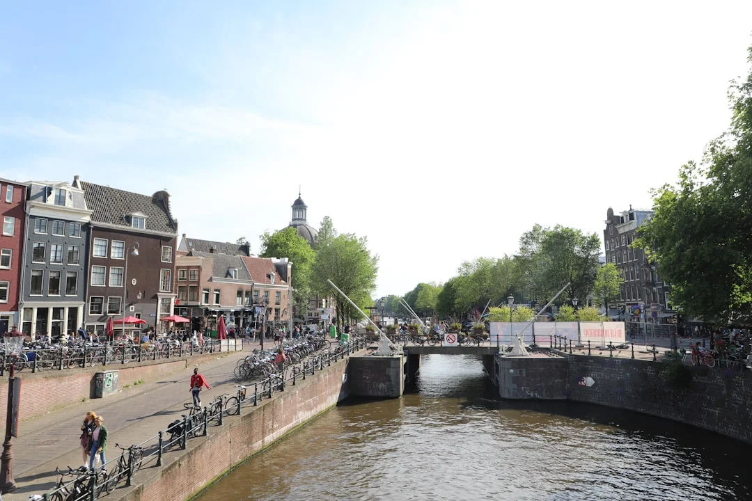 Bicycles parked along a canal in Amsterdam