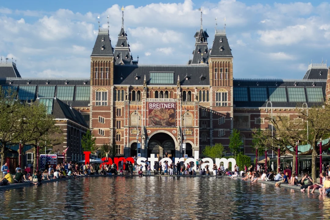 people in front of brown concrete building during daytime